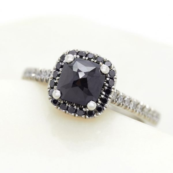 pavillion set blue sapphire engagement ring with black diamond halo