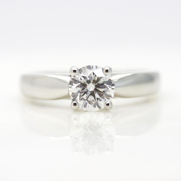 round diamond solitaire engagement ring with platinum tapered band