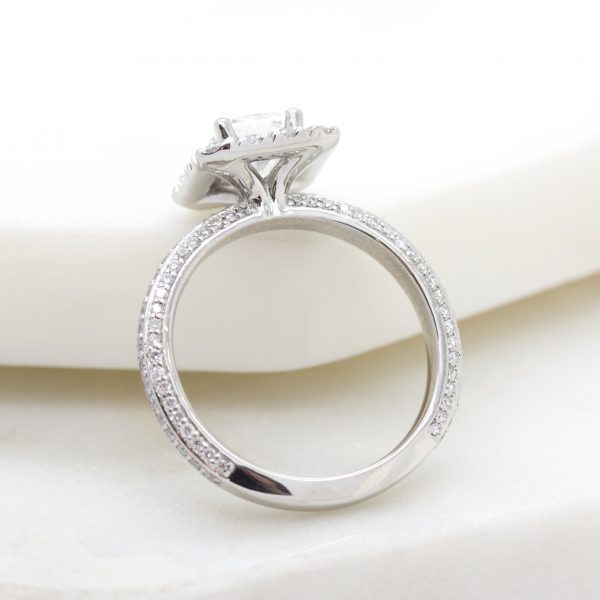 three sided diamond pave band with radiant diamond center and diamond halo
