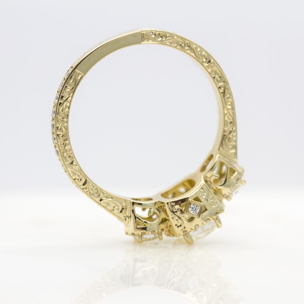 engagement ring with filigree and hand engraving detail