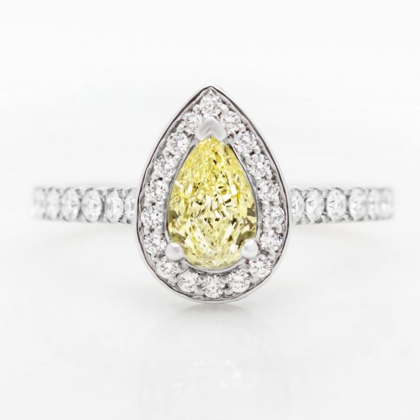 fancy yellow pear shape diamond with diamond halo engagement ring