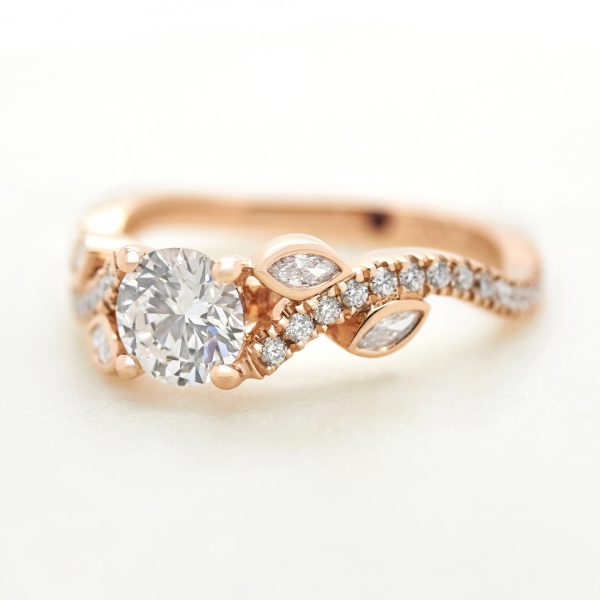 round diamond rose gold engagement ring with marquise diamond flower leaf design