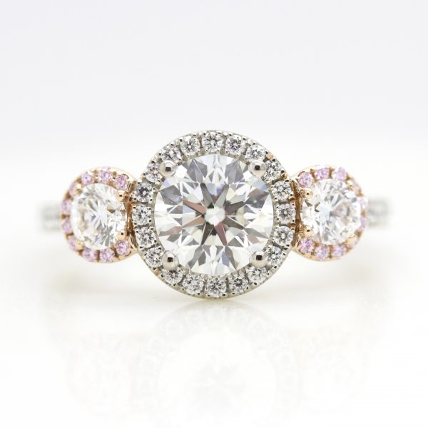 mixed metal round diamond halo trilogy engagement ring