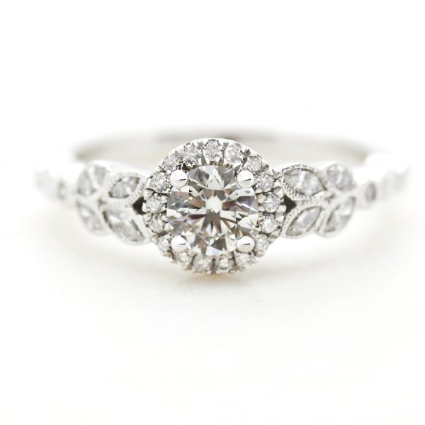 round diamond halo engagement ring with marquise diamond leaf vine milgrain design