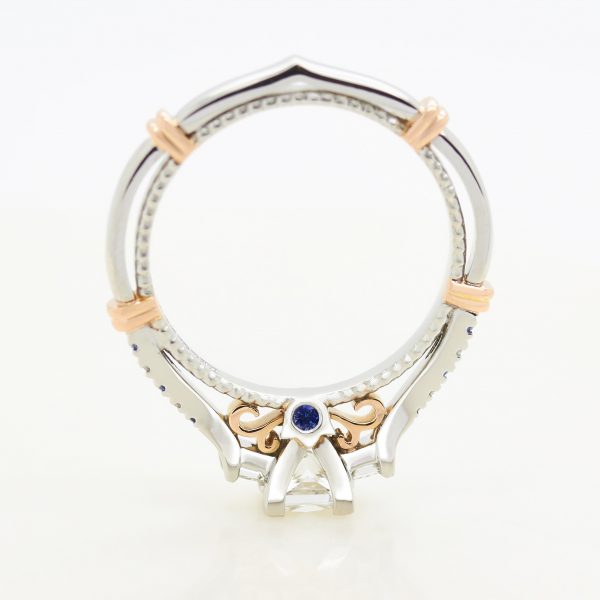 mixed metal engagement ring platinum and rose gold milgrain and bars with filigree and blue sapphire surprise setting taylor andhart