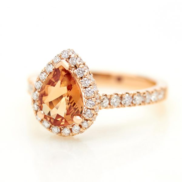 orange pear shape sapphire with diamond halo engagement ring