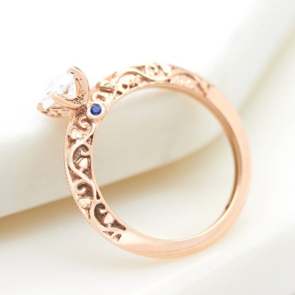 rose gold engagement ring with filigree cut out engraving detail